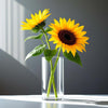 Two sunflowers in a clear vase against a gray background
