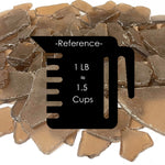 Pile of brown chocolate pieces with a reference icon and measurement text.