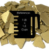 Gold-colored metal碎片 with a reference label for weight and volume.