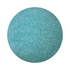 Sea Blue colored sand arranged in a circular shape on a white background