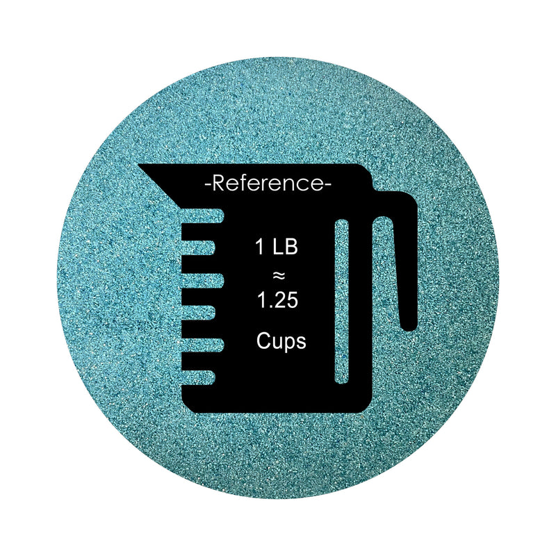 Sea Blue colored sand arranged in a circular shape on a white background colored sand in a circular shape with a measuring cup showing quantity.