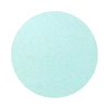 Turquoise Blue colored sand arranged in a circular shape on a white background