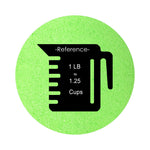 Neon Green colored sand arranged in a circular shape on a white background colored sand in a circular shape with a measuring cup showing quantity.