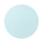 Light Blue colored sand arranged in a circular shape on a white background