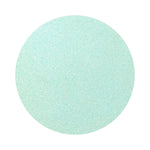 Mint Blue colored sand arranged in a circular shape on a white background