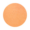 peach orange colored sand arranged in a circular shape on a white background