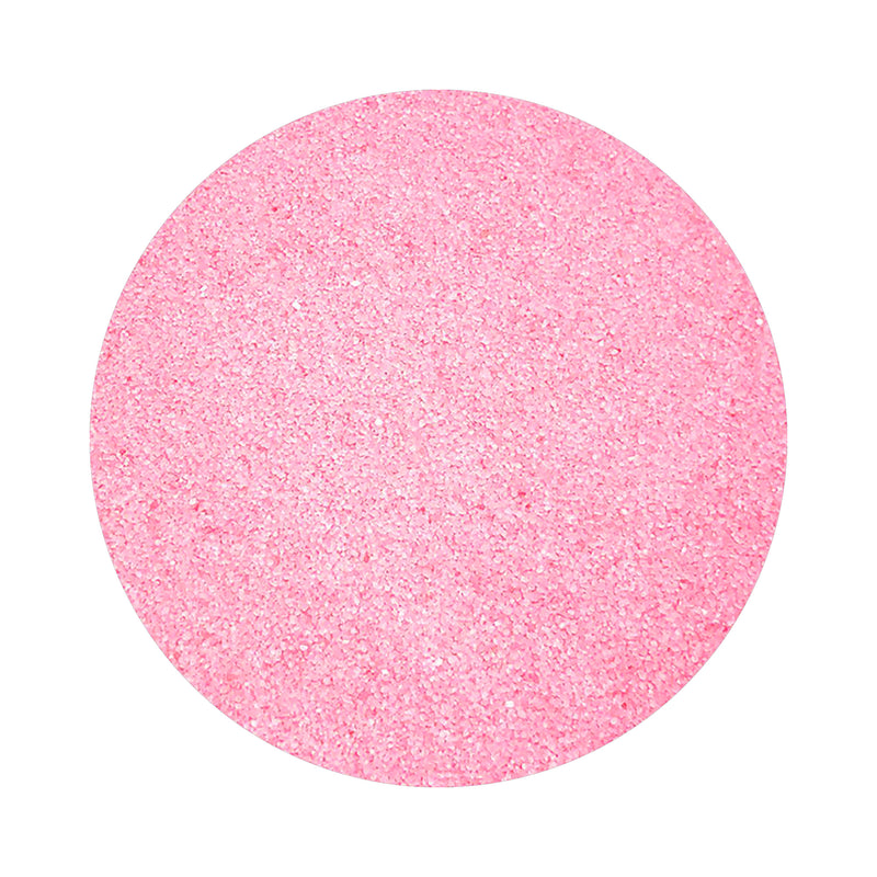 Hot Pink colored sand arranged in a circular shape on a white background