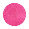 Dark Pink colored sand arranged in a circular shape on a white background