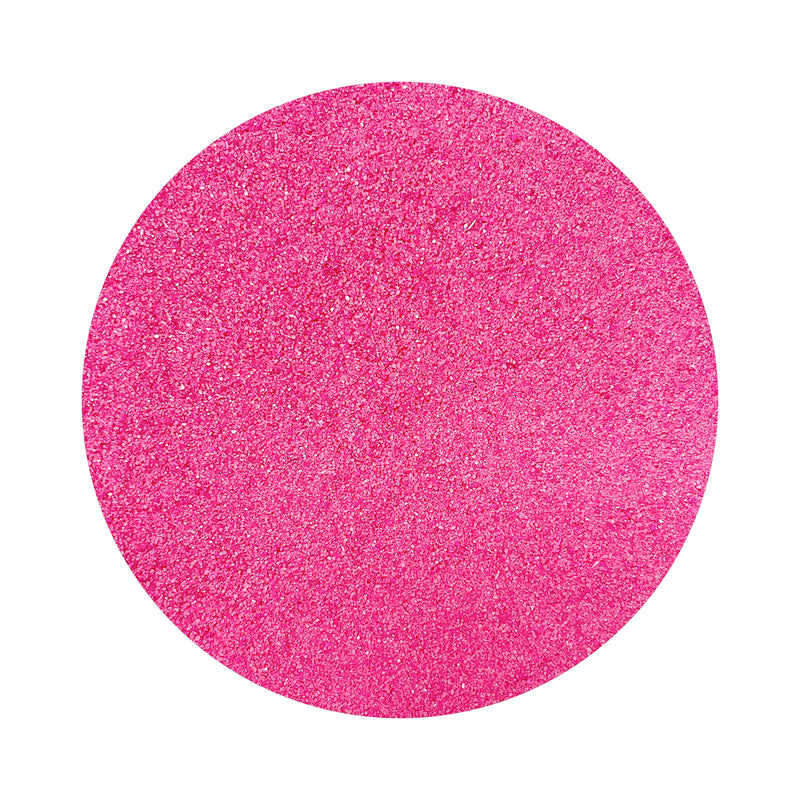 Dark Pink colored sand arranged in a circular shape on a white background