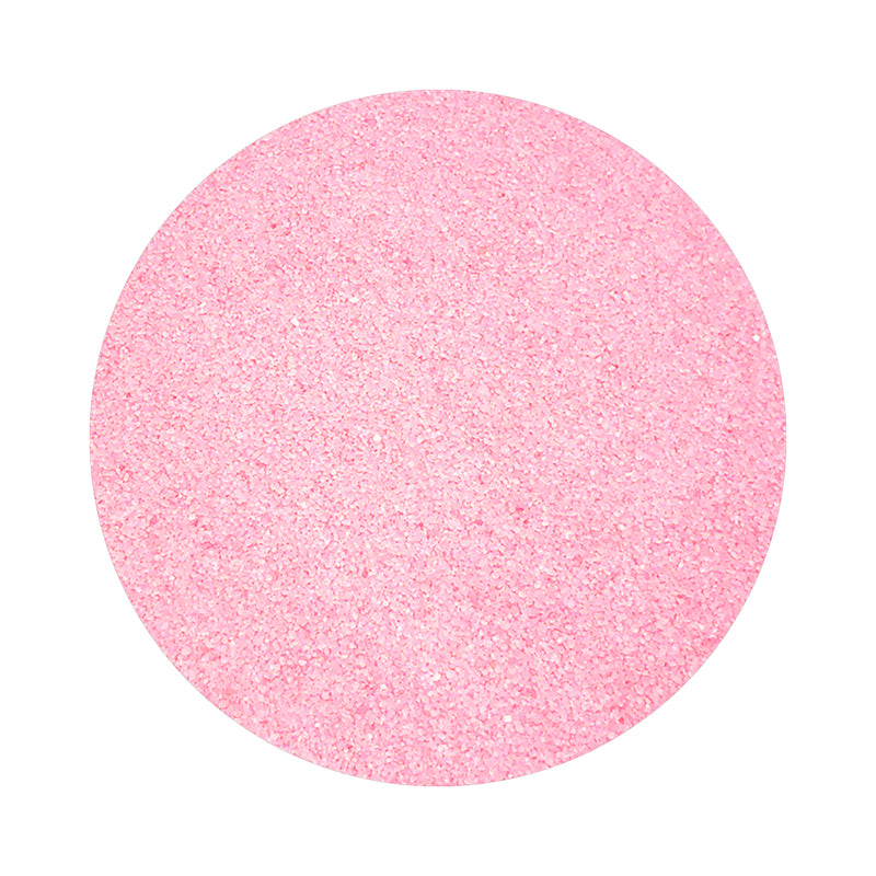 Light Pink colored sand arranged in a circular shape on a white background