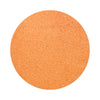 Salmon Pink colored sand arranged in a circular shape on a white background