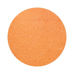 Salmon Pink colored sand arranged in a circular shape on a white background