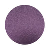 Dark Purple colored sand arranged in a circular shape on a white background