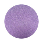 Violet Purple colored sand arranged in a circular shape on a white background