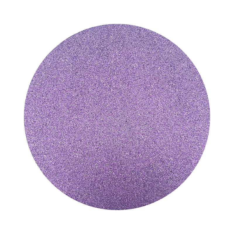 Violet Purple colored sand arranged in a circular shape on a white background