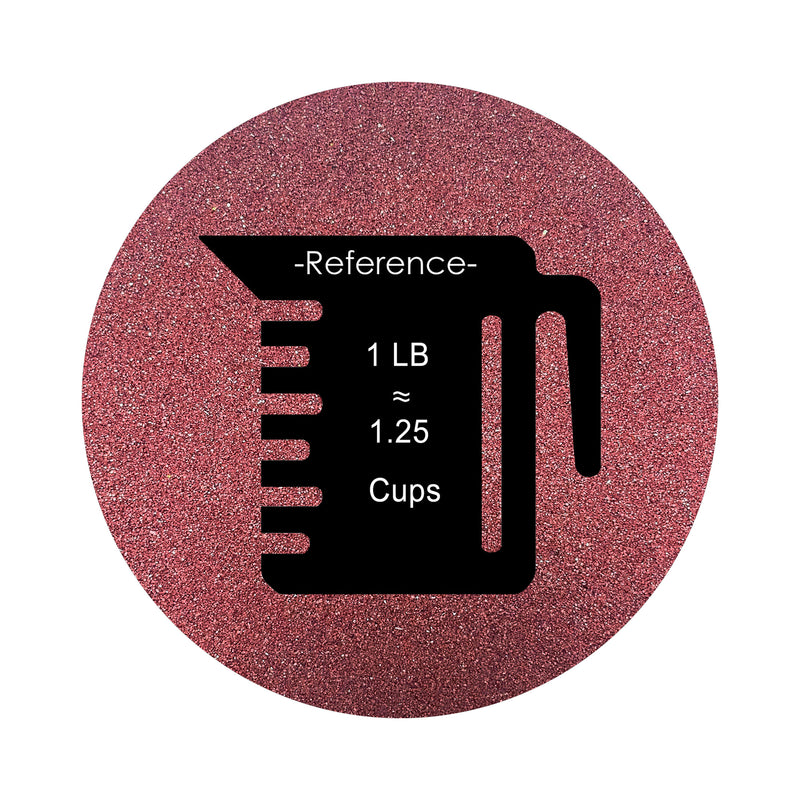 Burgundy Red colored sand arranged in a circular shape on a white background colored sand in a circular shape with a measuring cup showing quantity.