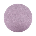 violet colored sand arranged in a circular shape on a white background
