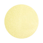 Buttermilk Yellow colored sand arranged in a circular shape on a white background