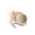 Wooden bowls with rope handles on a white background