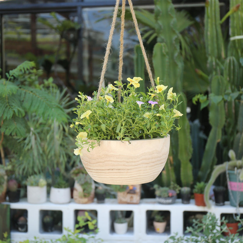 Hanging basket with flowers in a garden setting