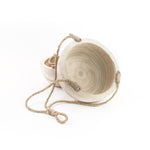Wooden bucket with rope on a white background