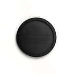 Black circular object on a white background