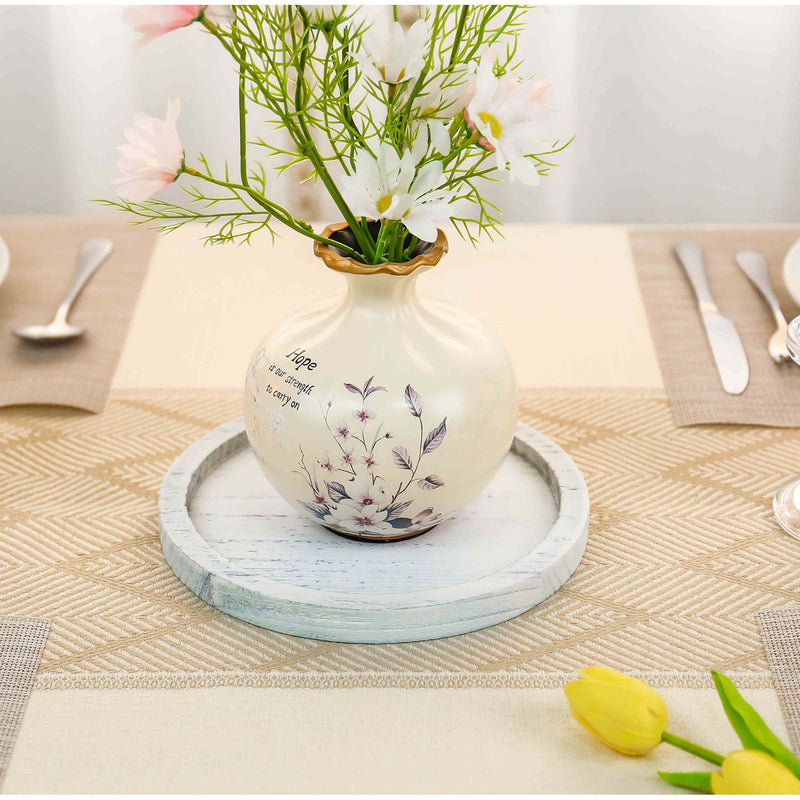 Decorative vase with floral design on a table setting