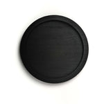 Black round tray on a white background