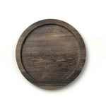 Round wooden tray on a white background