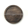 Wooden round coaster with measurement label on a white background