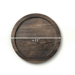 Wooden round coaster with measurement label on a white background