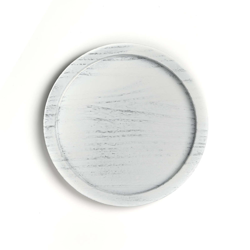 Round marble-patterned plate on a white background