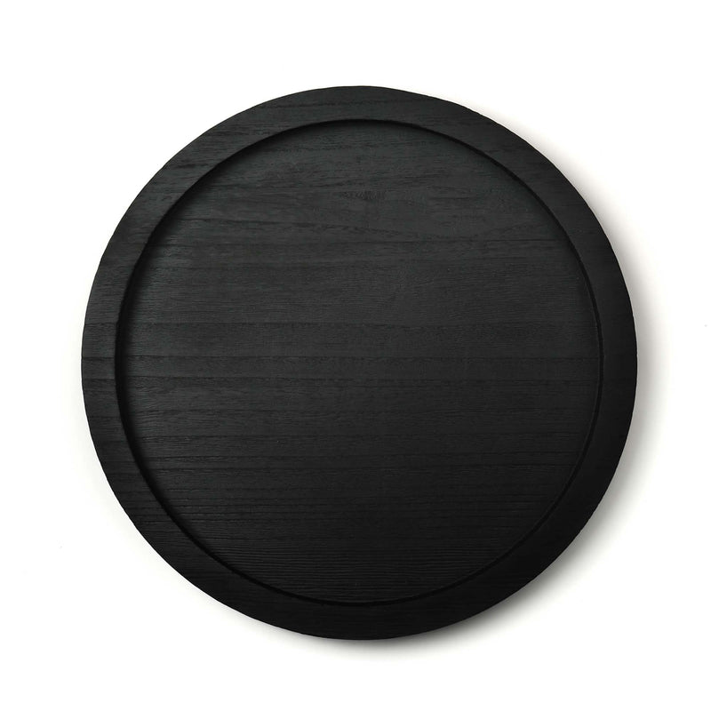 Black circular tray on a white background