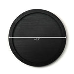 Black circular object with a measurement label indicating approximately 13 inches on a white background
