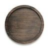 Round wooden tray with a dark brown finish on a white background