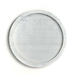 Round wooden tray with a light gray finish on a white background