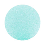 baby blue colored sand arranged in a circular shape on a white background