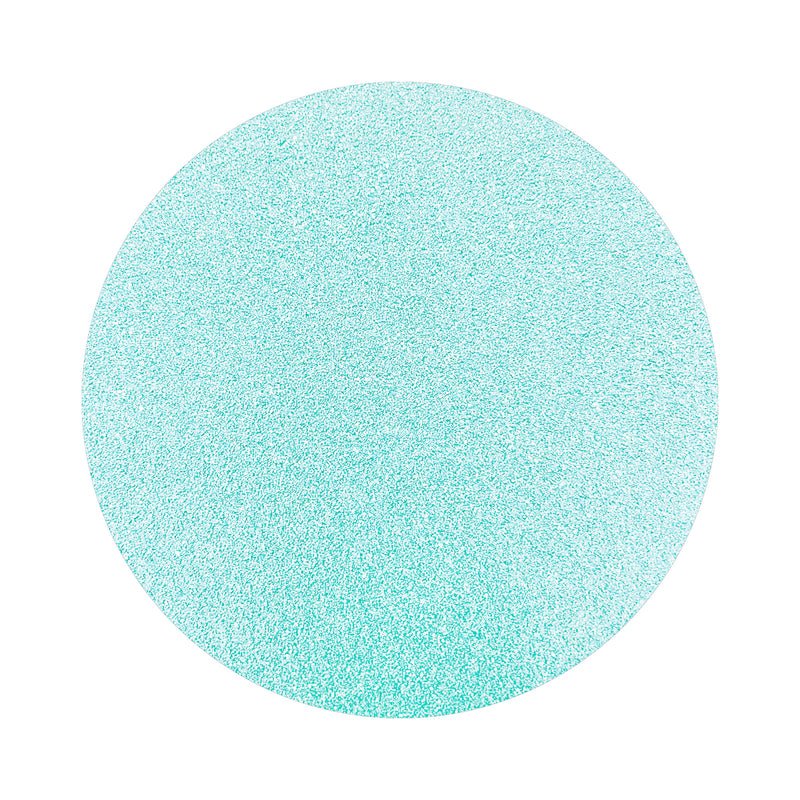 baby blue colored sand arranged in a circular shape on a white background