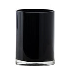 Black cylindrical glass vase on a white background