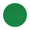 Dark green colored sand arranged in a circular shape on a white background