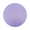lavender purple colored sand arranged in a circular shape on a white background
