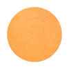 orange colored sand arranged in a circular shape on a white background