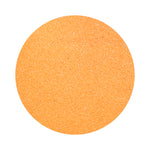 orange colored sand arranged in a circular shape on a white background