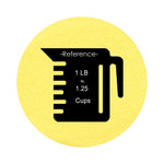 Light Yellow colored sand arranged in a circular shape on a white background colored sand in a circular shape with a measuring cup showing quantity.