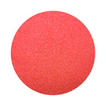 red colored sand arranged in a circular shape on a white background