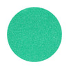 Turquoise colored sand arranged in a circular shape on a white background